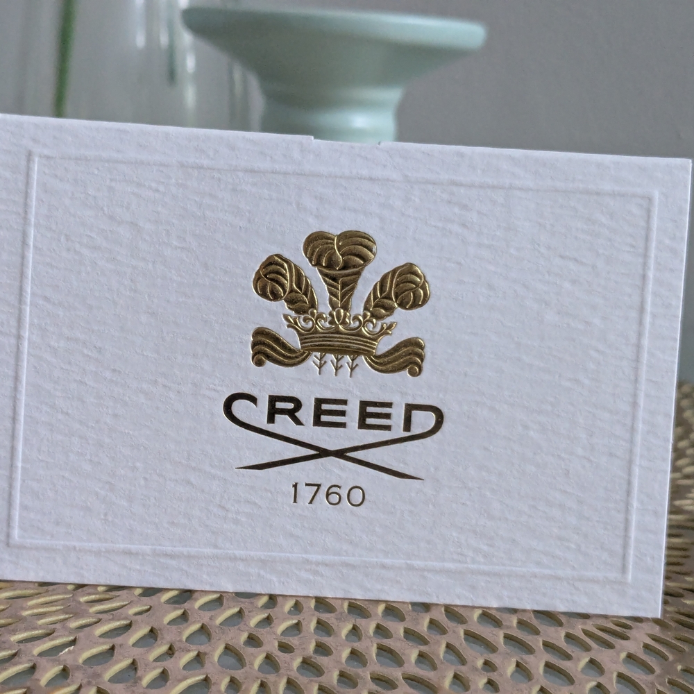 Creed Gold and White Business Card Design